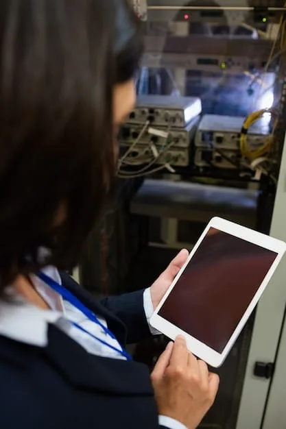 A close-up shot of a technician using a cloud networking monitoring tool on a tablet to diagnose and resolve a network issue, showing detailed diagnostic data and remote access capabilities.