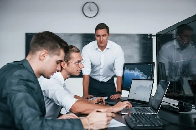 A group of cybersecurity professionals participating in a hands-on training session, using laptops and network equipment to simulate real-world scenarios. The image should convey a sense of active learning and skill development.