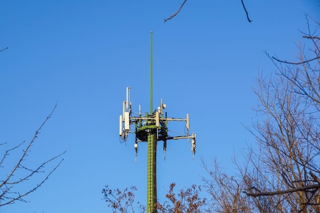 A close-up view of a 5G mmWave antenna installed on a light pole, with a blurred background showing a busy city street. The image emphasizes the small size and discreet installation of mmWave infrastructure.